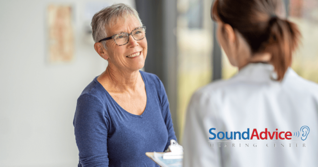 woman receiving checkup from doctor