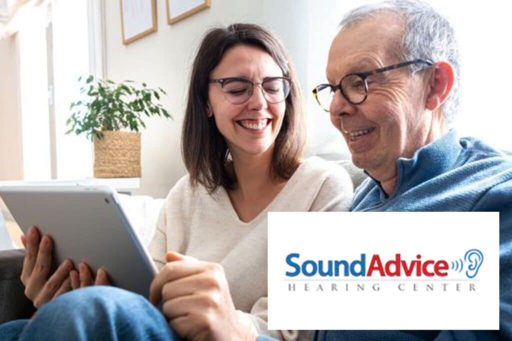 older father and daughter sitting and laughing