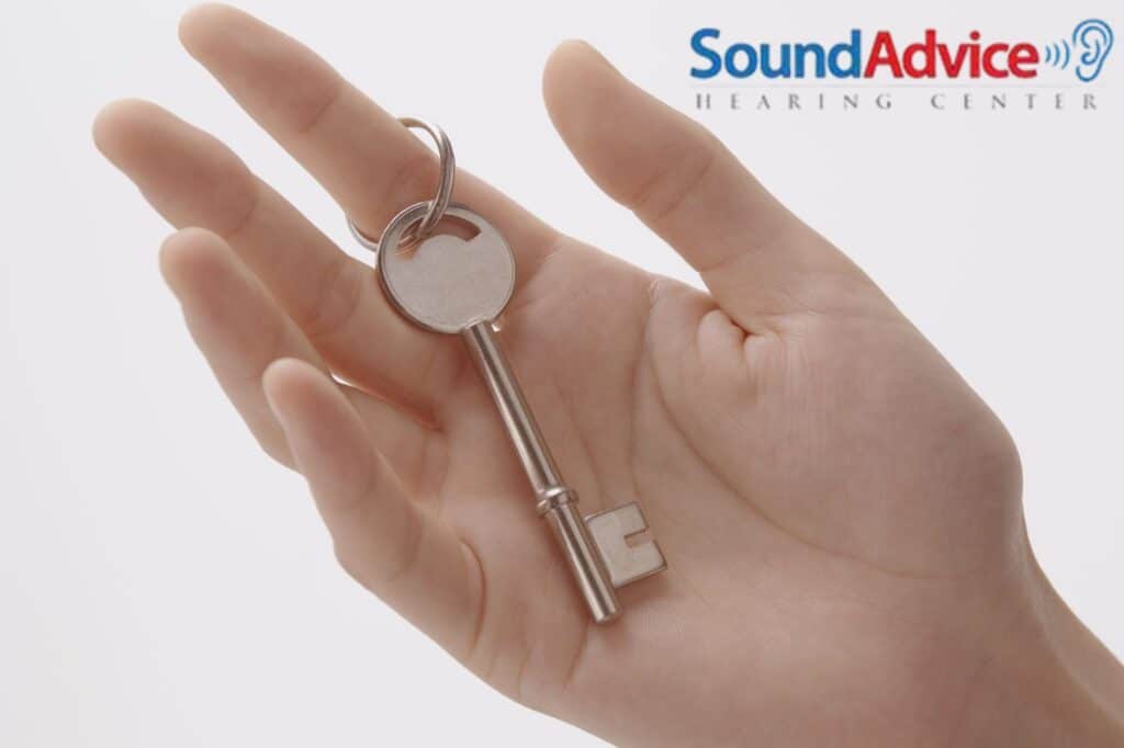 woman's hand holding a key